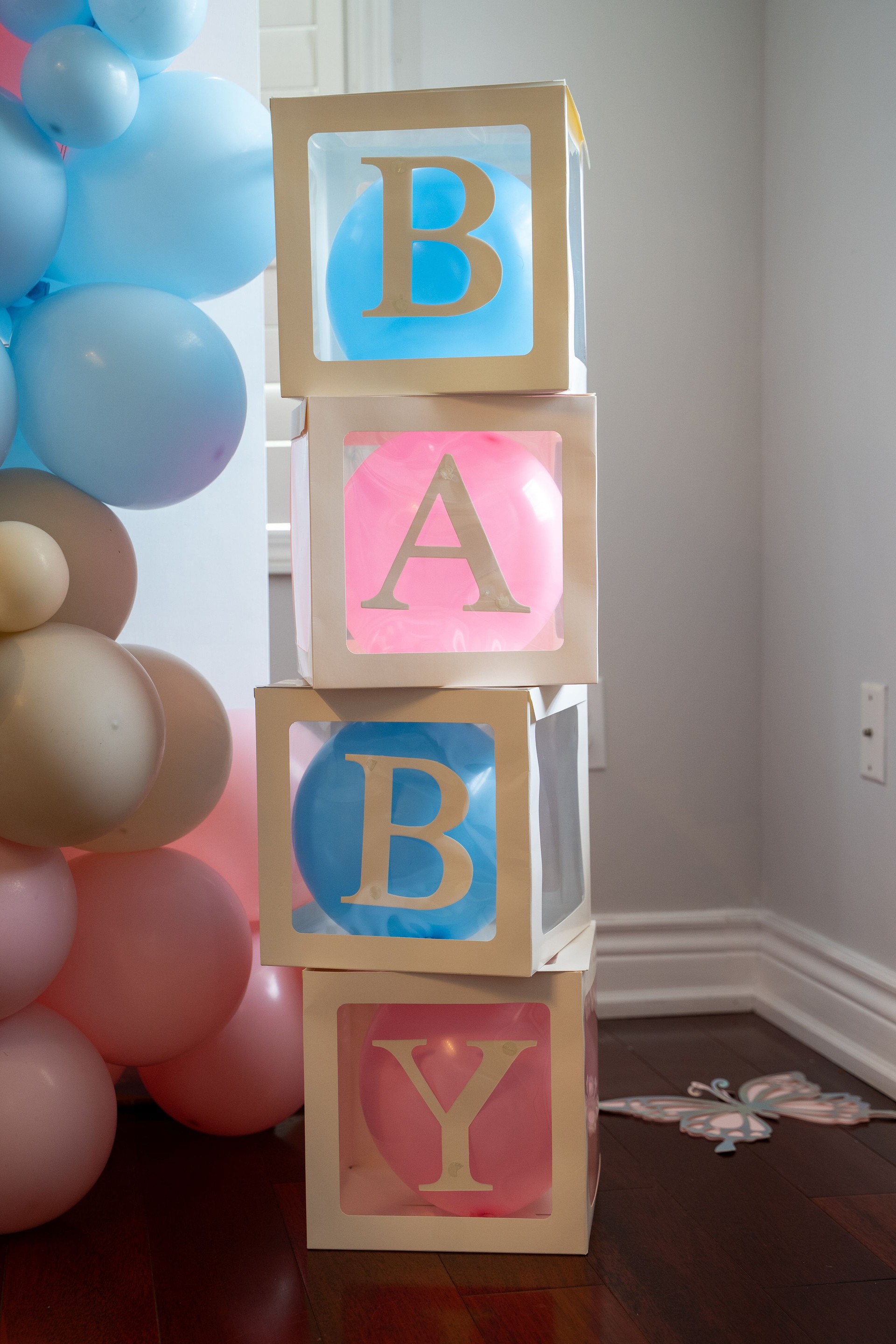 Baby shower decorations and event setup with balloon arrangements.